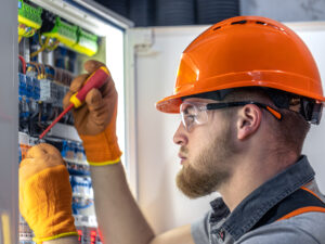 male-electrician-working-switchboard-male-electrician-overalls-working-with-electricity.jpg